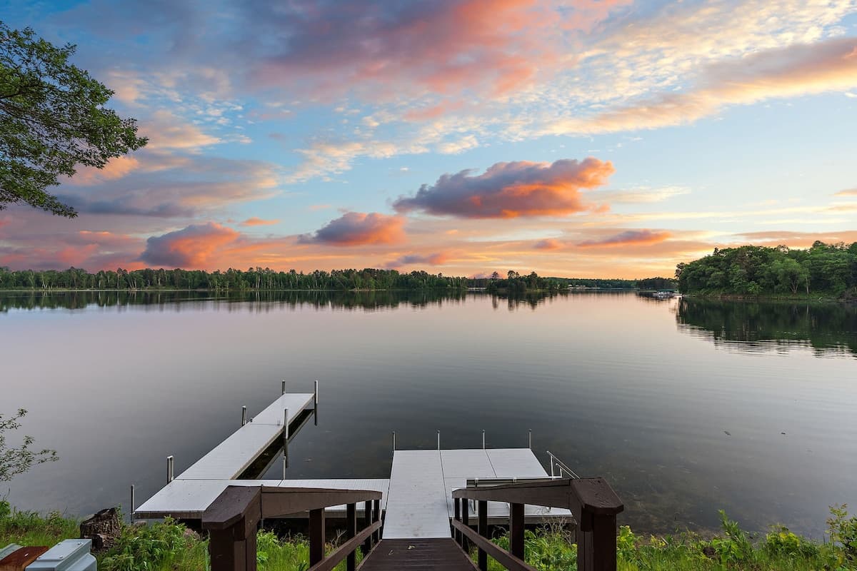 Sunset over the Whitefish Chain of Lakes with docks in the foreground near Crosslake, MN